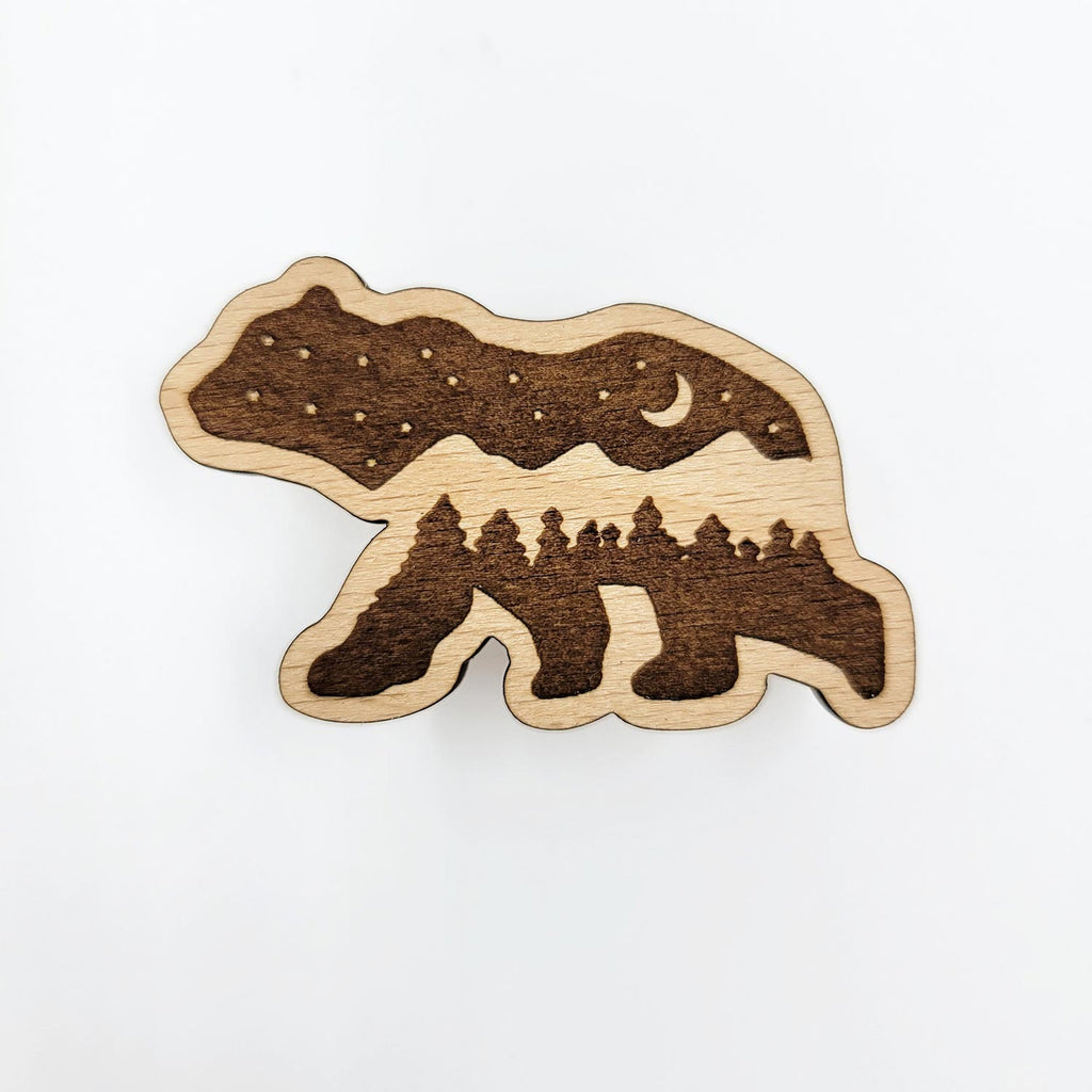 Bear shaped wood pin, with engraved mountains and night sky