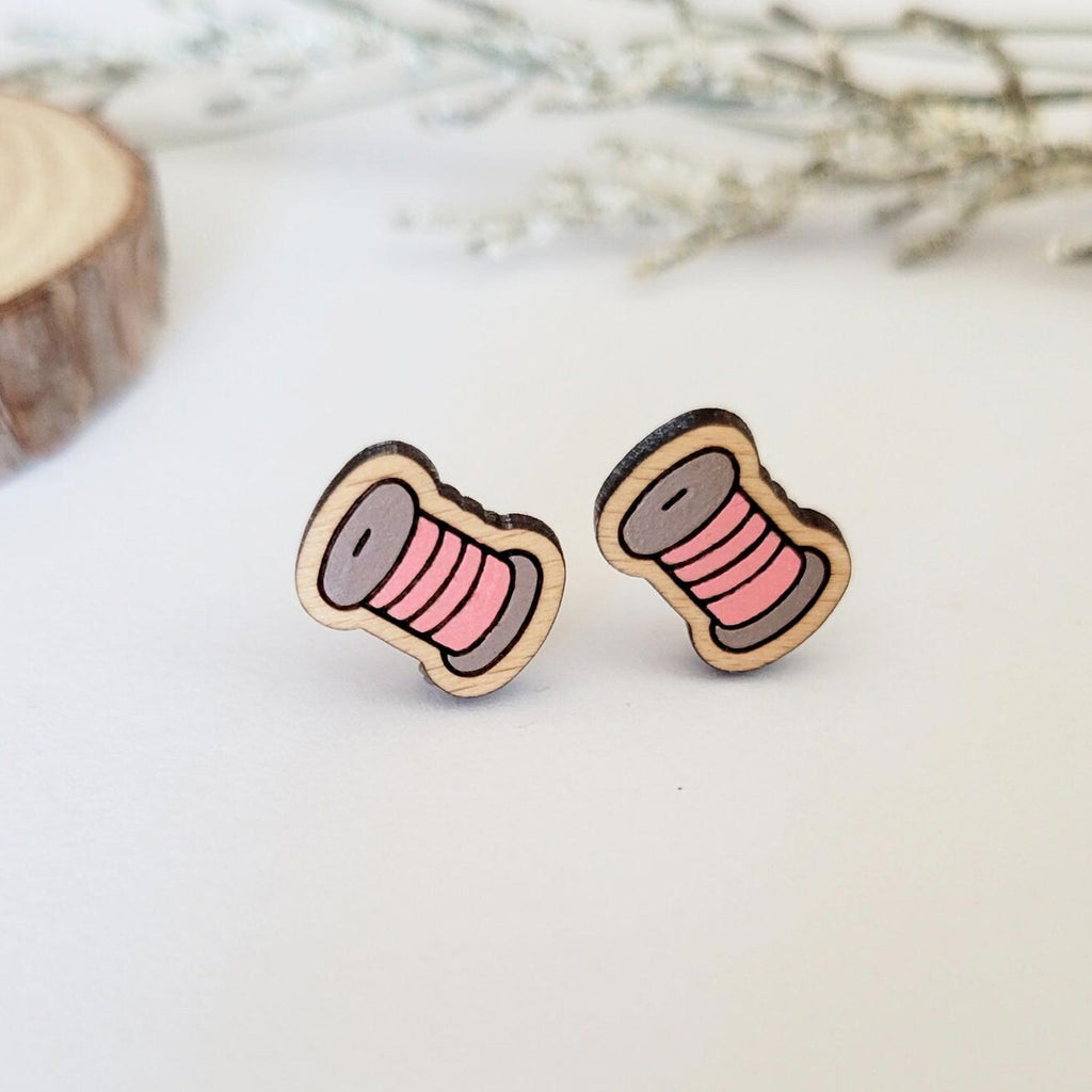 Pink thread spool engraved stud earrings
