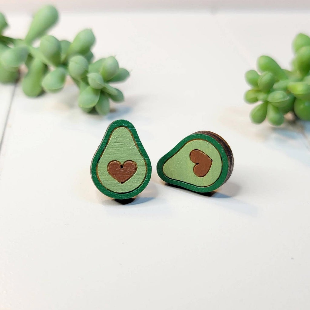 Avocado stud earrings with heart seed