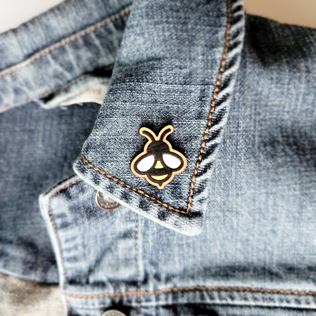 Bee shaped wooden pin on a jacket