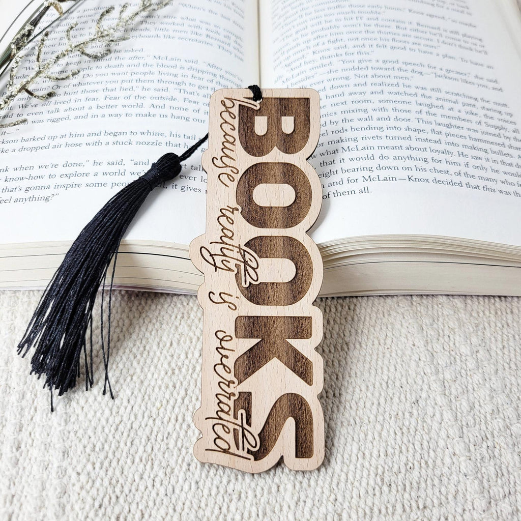 'Books, because reality is overrated' engraved wood bookmark, with tassel
