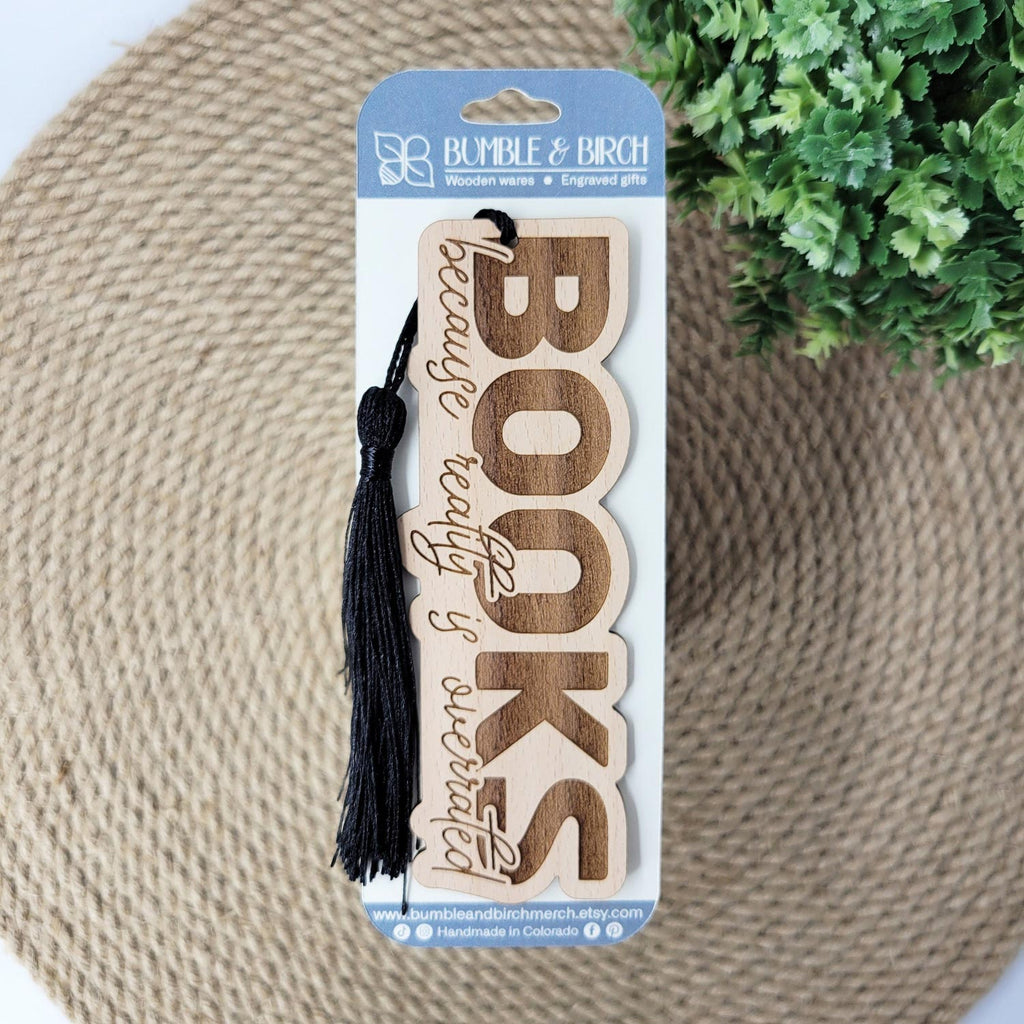 'Books, because reality is overrated' engraved wood bookmark, with tassel and packaging