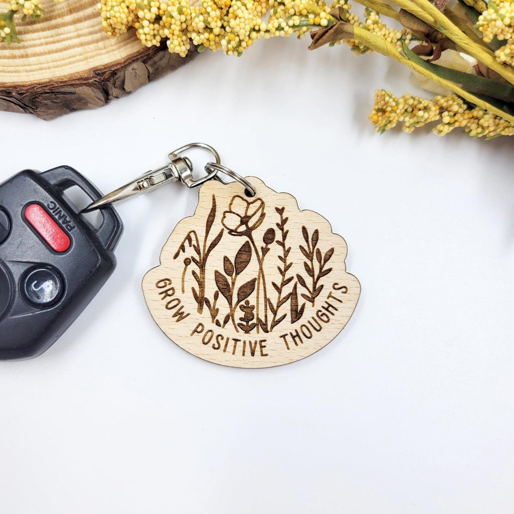 'Grow positive thoughts' floral wooden keychain