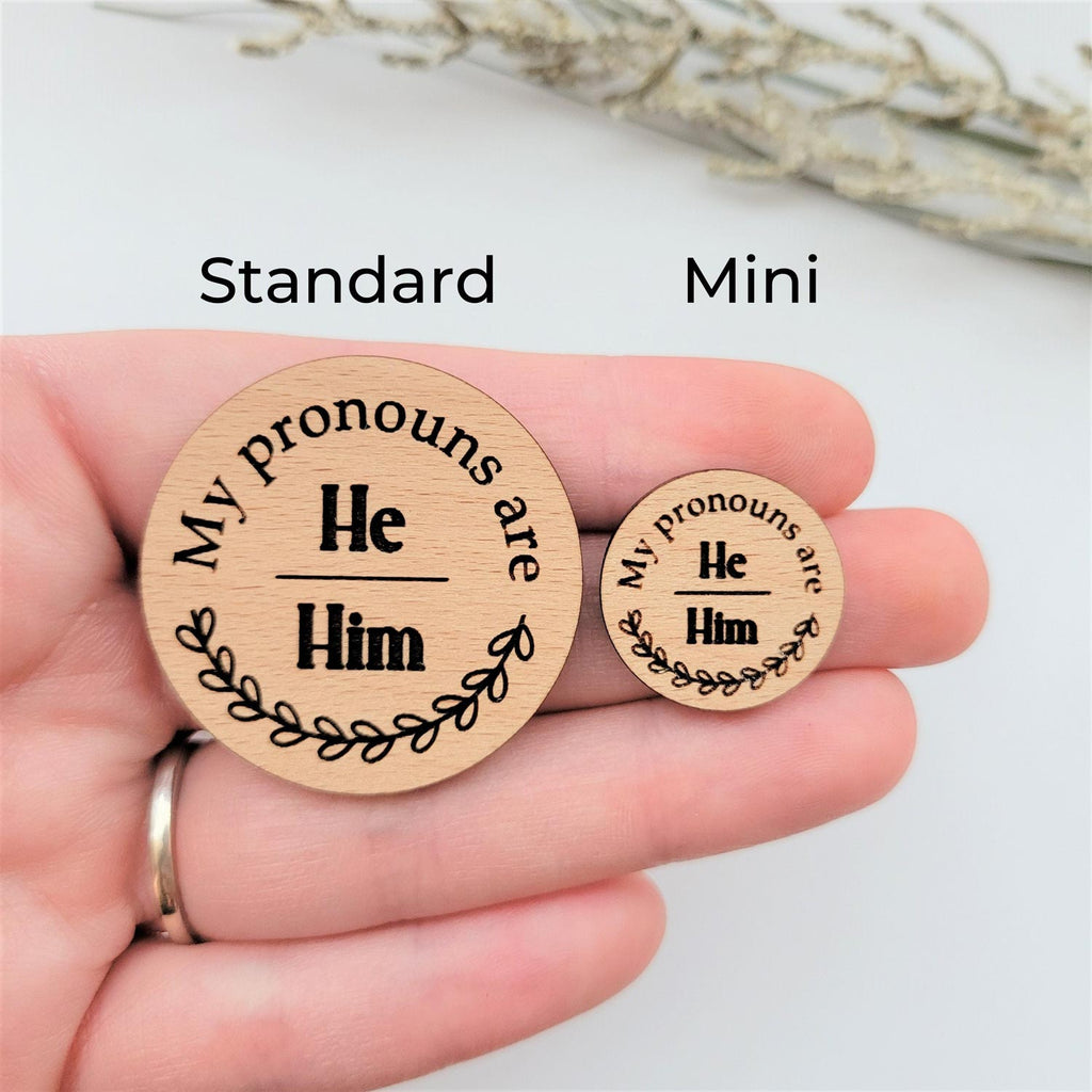 My pronouns are He/Him wood round pin, standard and mini size