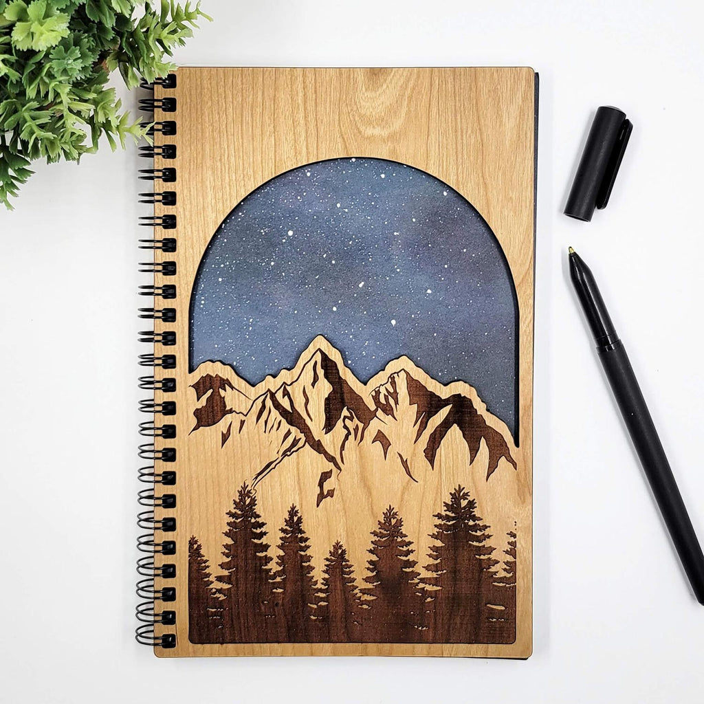 Starry mountains cut wood journal with galaxy background