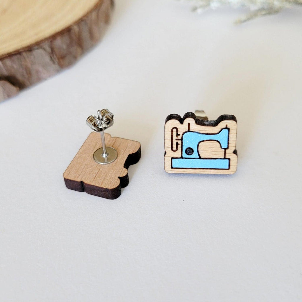 Blue sewing machine shaped stud earrings, front and back