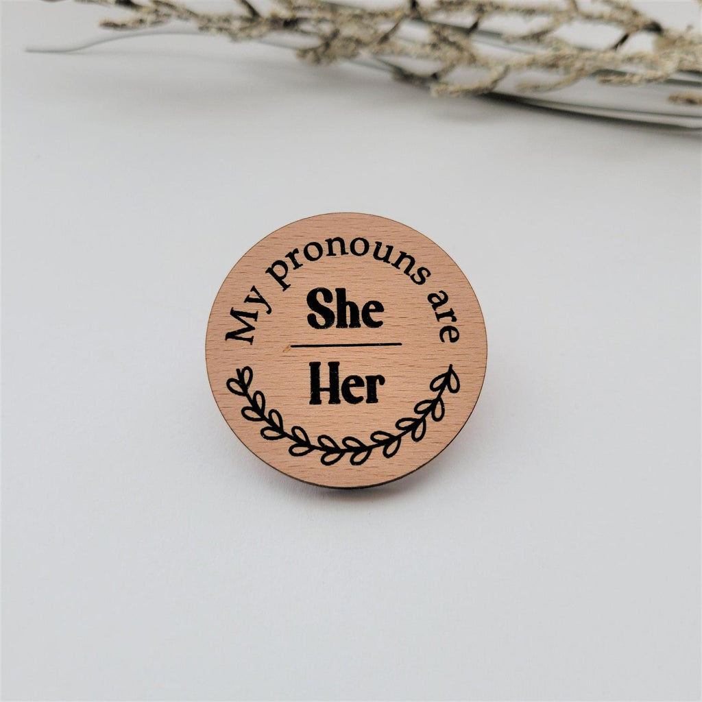 My pronouns are She/Her wood round pin