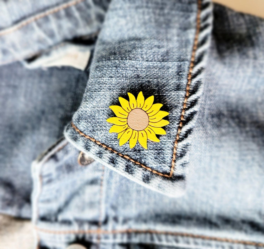 Sunflower shaped wood pin on a collar