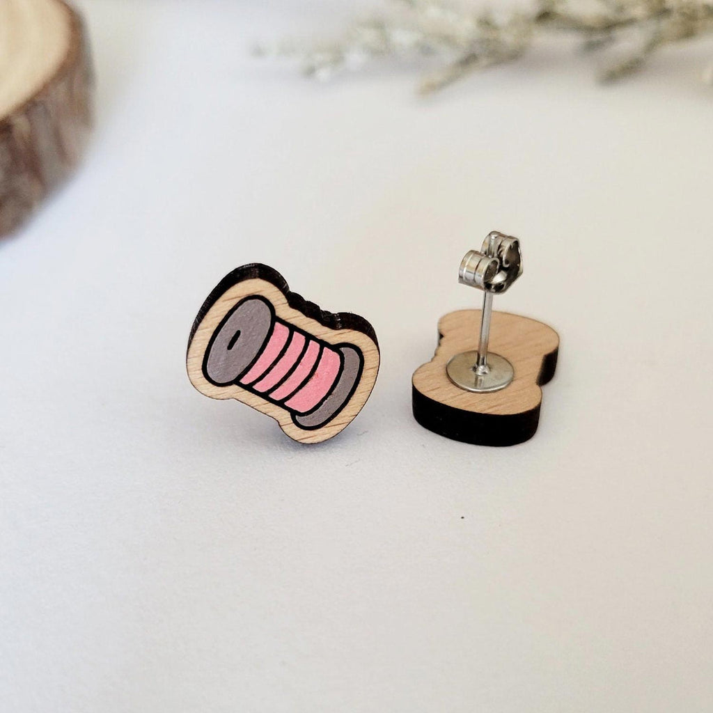 Pink thread spool engraved stud earrings, front and back
